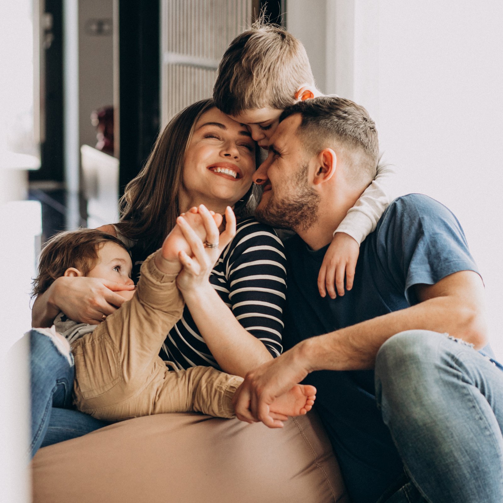 Happy family enjoying time together at home, representing the benefits of lower energy bills and trusted partnerships with Switchalyzer